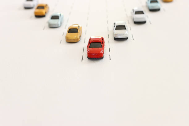 Concept image of challenge and teamwork. Red car leading the group.
