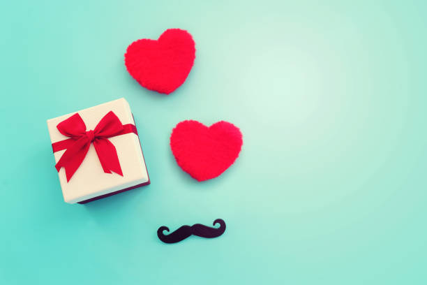 istock Father's day concept. present box and red fluffy hearts over blue background. top view, flat lay 2153830169