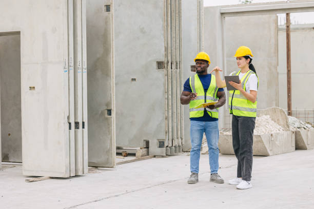 istock Engineer smart women working contact with African black worker in Precast concrete casting manufacturing company site inspector 2153832927