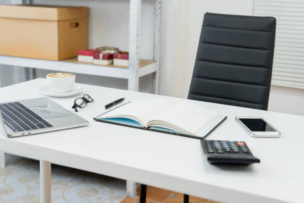 istock laptops, books, and coffee fueling productivity in a modern office space designed for efficiency and creativity. 2153833808