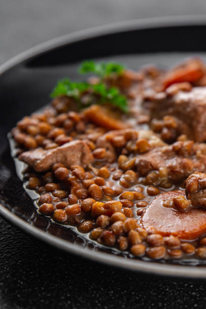 lentils with meat beef or pork fresh cooking appetizer meal food snack on the table copy space food background rustic