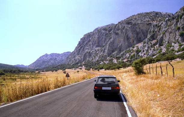 view of asphalt road against mountain