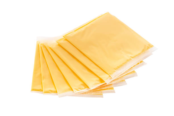 istock Slices of processed cheese in individual packaging isolated on white background 2153838875