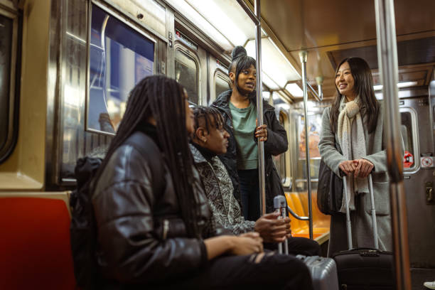 istock Diverse Students Riding New York Subway Train 2153840651
