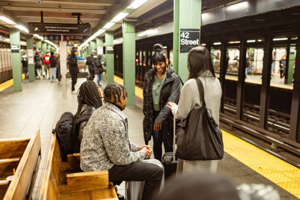 istock Diverse Students Engaged in Conversation at NYC Subway Station 2153840656