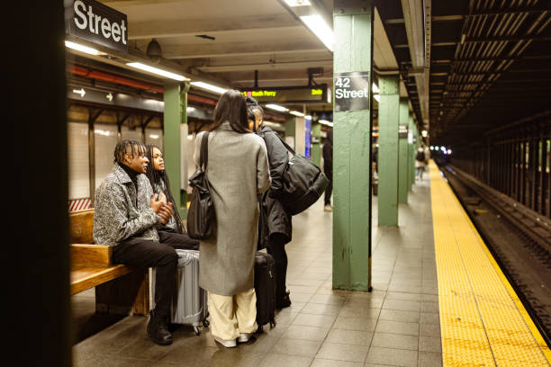 istock Diverse Group of Students Waiting at NYC Subway Platform 2153840740