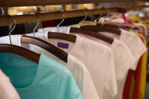 Variety of Women's Tops collection Close-up shot variety of Women's Tops collection, in white and turquoise color colorful check shirts on sale at a clothing store stock pictures, royalty-free photos & images