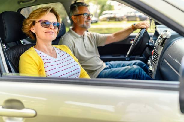 istock Happy couple enjoying while traveling by SUV 2153841957