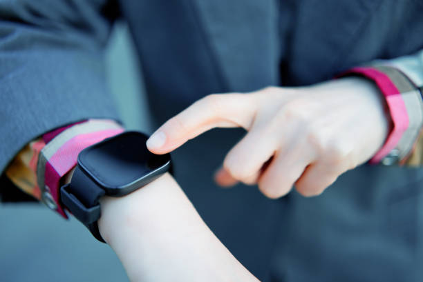 istock Business Executive Interacting with Modern Smartwatch 2153844189