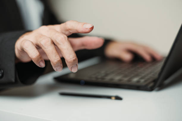 istock A Hand of Professional Man is Gesturing or Pointing Towards the Screen 2153844210