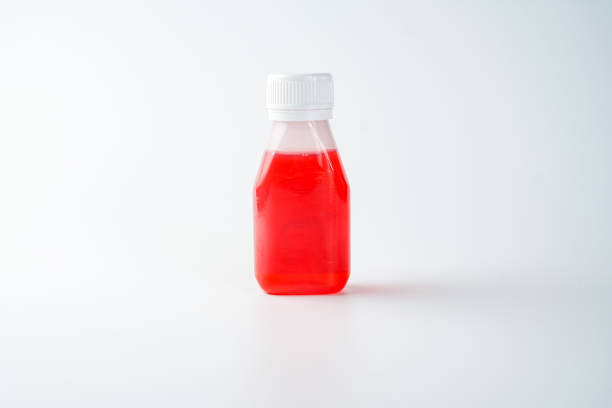 colorful powdered color pigments in small corked bottles.