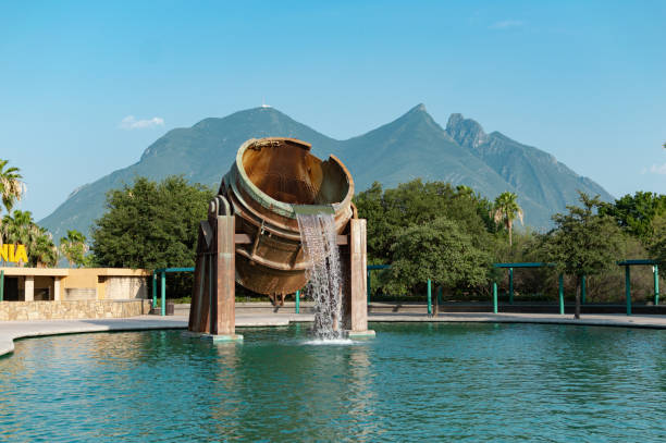 Majestic Fountain of the Crisol in the Fundidora Park with the Cerro de la Silla in the background