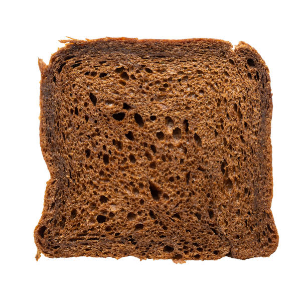 A slice of bread with holes in it. The bread is brown and has a crust. The bread is cut in half and is placed on a white background