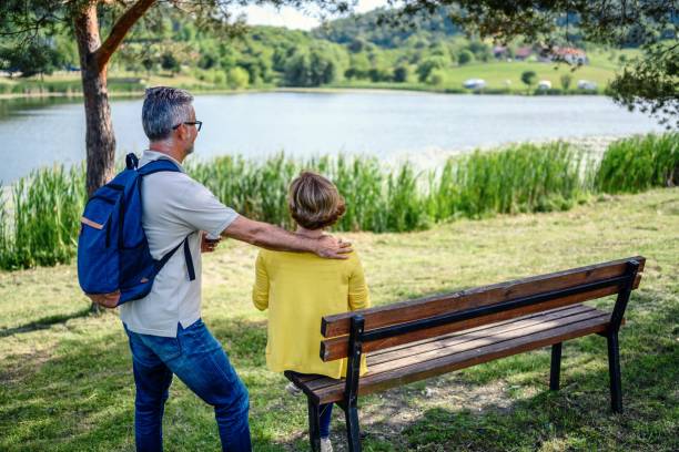 istock Mature couple is relaxing by the lake 2153845725