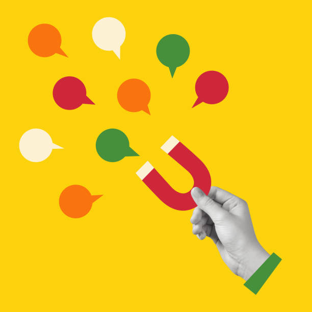 یک دست که آهنربایی را نگه داشته و یک حباب مکالمه، نشاندهنده تعامل و ارتباط