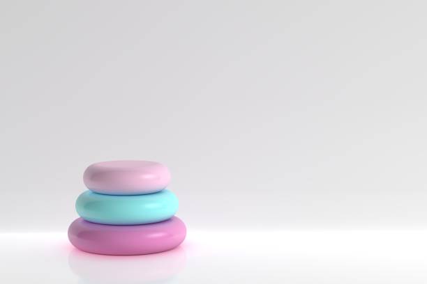 Colorful objects standing in a row on white background, empty stage for product presentation