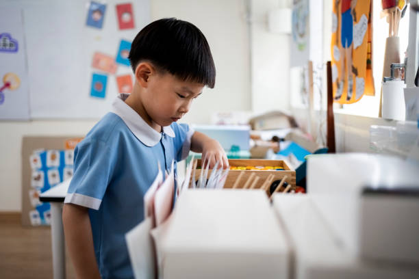istock Cute schoolgirl in her kindergarten classroom 2153851399