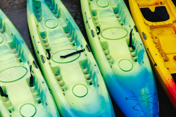 istock Colorful Kayaks Arranged Neatly on The Dock, Ready for Launch 2153855397