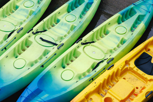 istock Colorful Kayaks Arranged Neatly on The Dock, Ready for Launch 2153855400