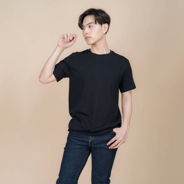 istock Young man posing in casual black t-shirt 2153857566