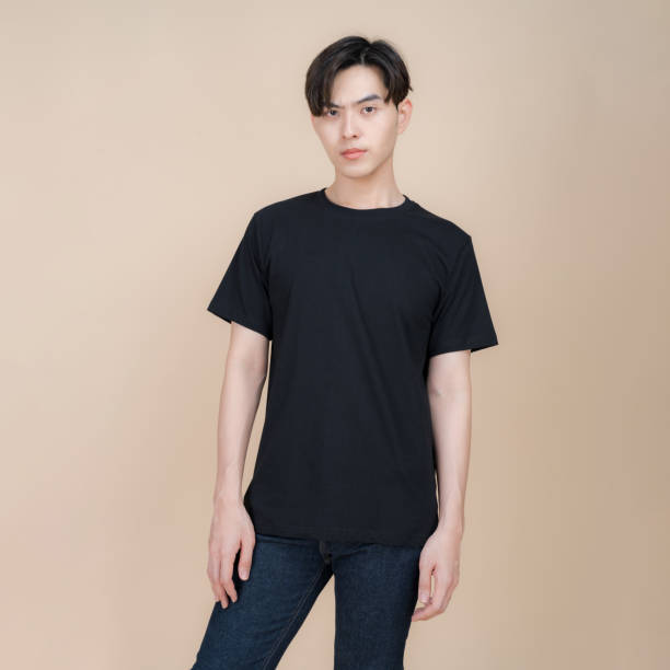 istock Young man posing in casual black t-shirt 2153857598