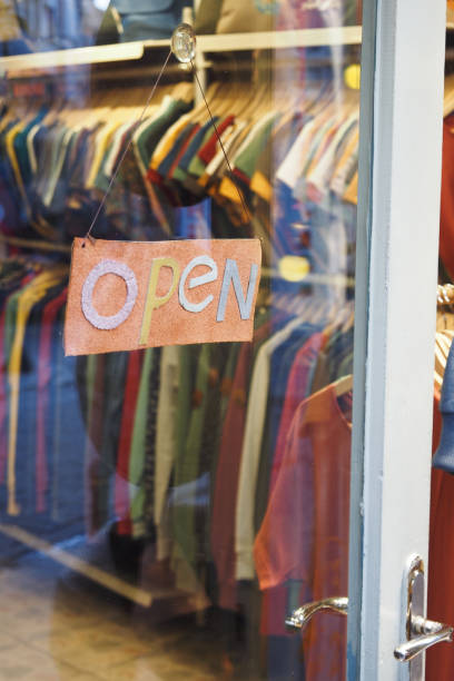 istock open text on paper hanging on cafe door 2153860296
