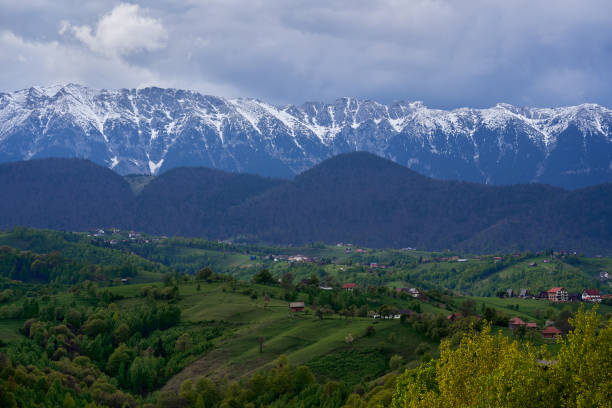 istock Mountains with snow and pine forests 2153861107