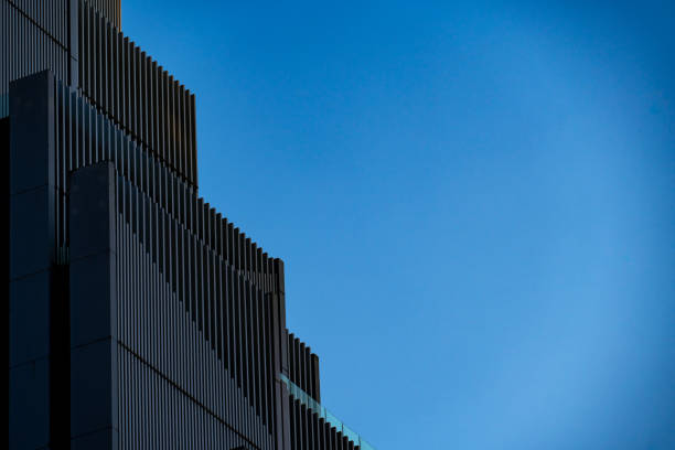 Abstract pattern, facade of a minimalist business building, leaving space for text.