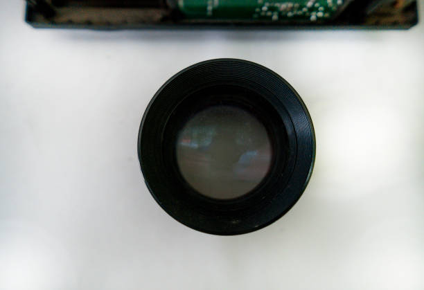 Close-up view of parts and components of a disassembled vintage film camera shutter mechanism