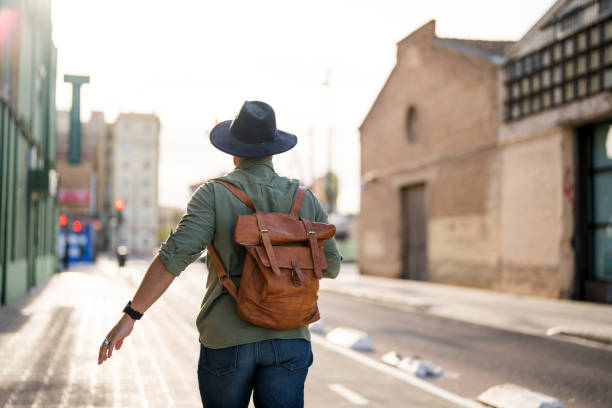 istock Joyful Hispanic Man Enjoying City Walk in Fedora 2153868846