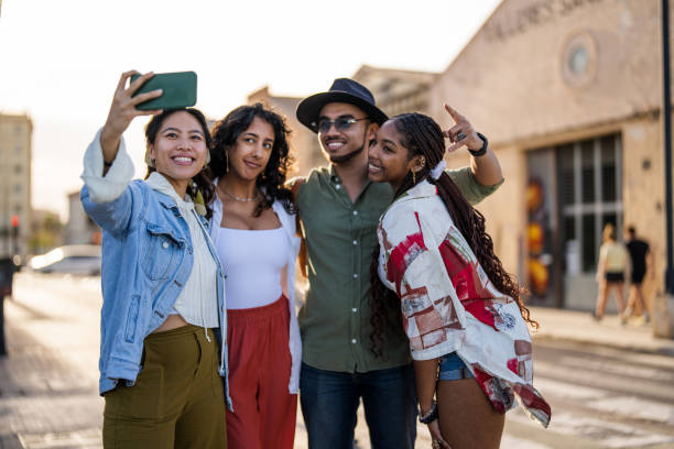 istock Joyful Diverse Friends Taking Group Selfie Outdoors 2153868849