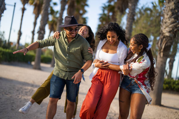 istock Joyful Multiracial Friends Gathered at the Park 2153869632