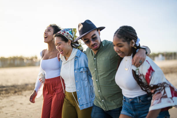 istock Joyful Group of Friends Enjoying a Beach Walk 2153869663