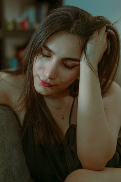 Portrait of a serene young woman resting with closed eyes, exuding calm and tranquility. Perfect for themes of relaxation, beauty, and peaceful moments.