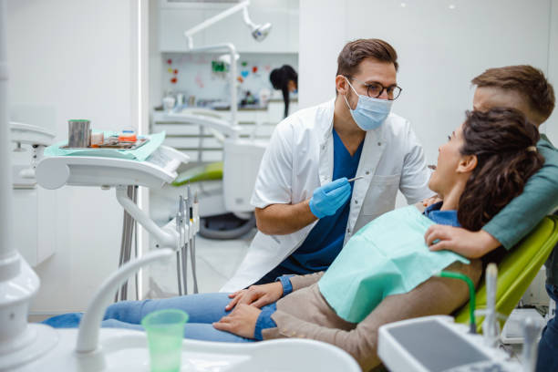 istock Dentist consulting with patient in clinic 2153871477