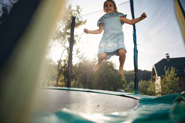 istock Beautiful girl enjoying summer on trampoline 2153873839