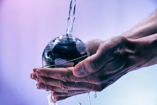istock Water pouring on planet earth 2153874250