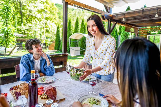 istock Woman setting up the table for lunch with her friends 2153875517