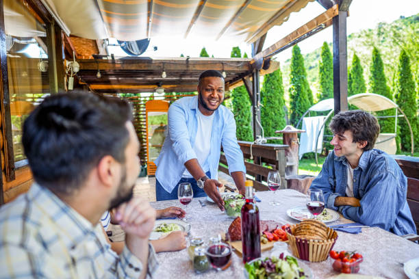 istock Man setting up the table for lunch in the backyard 2153875806