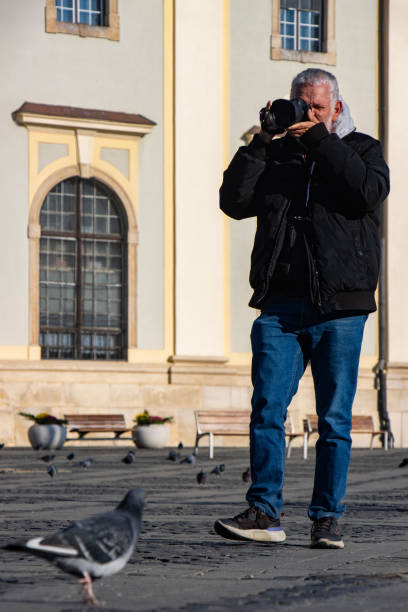 istock Senior man taking photos 2153876087