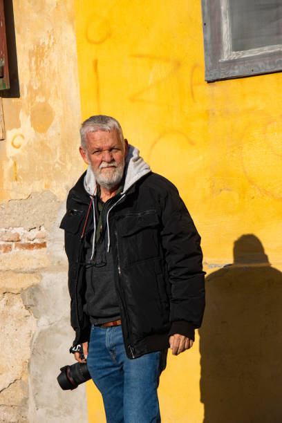 Senior man taking photos and enjoying a nice walk
