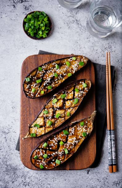 Teriyaki sesame seed baked eggplant in a cut board