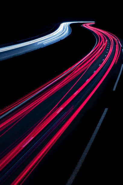 istock Vertical highway light cars speed 2153878598