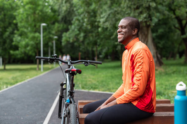 istock Cyclist resting in park, enjoying nature 2153880874