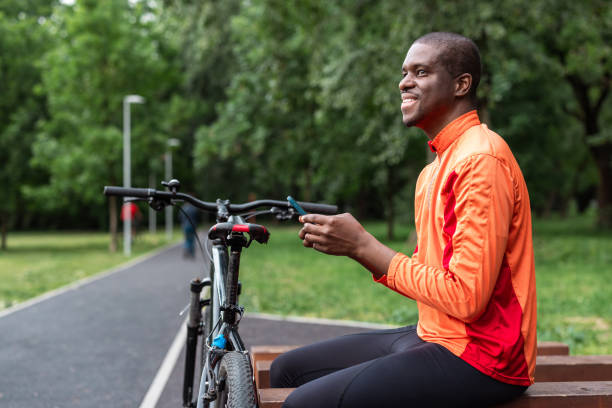 istock Green transportation - cyclist resting in park 2153880895