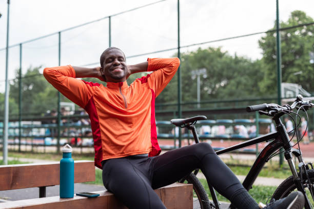 istock Man relaxing after a bike ride on a sunny day 2153880930