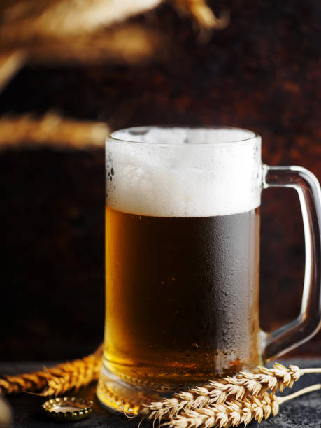 istock mug of light beer and wheat ears 2153885684