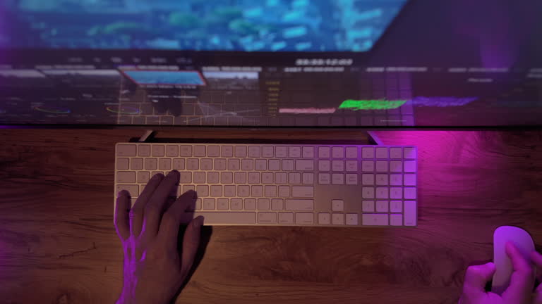 Top down shot of Video editing on a computer. Monitor the computer and capture color correction work of the program for video editing, Video processing, postproduction, clip maker