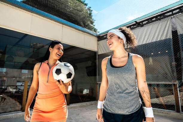 istock Friends talking and walking before footvolley 2153893169