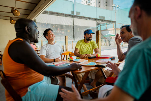 istock Tennis players friends talking on a restaurant 2153893373